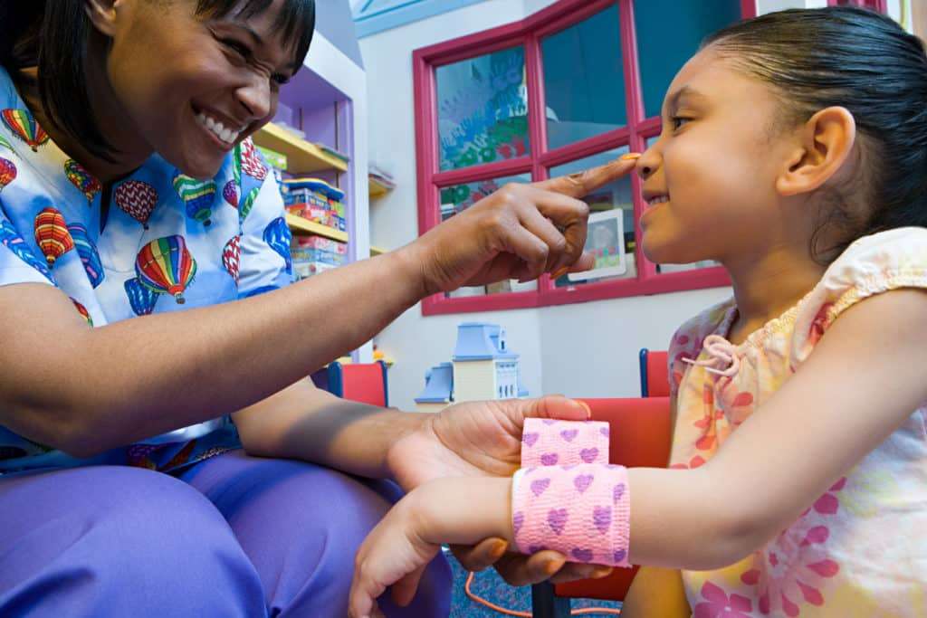 Nurse caring for girl